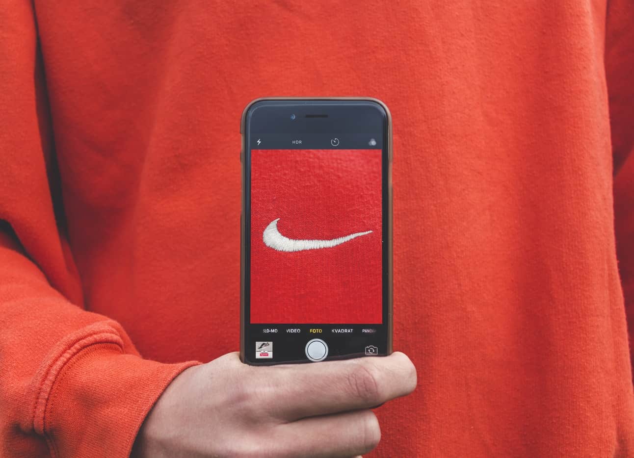 Nike logo in a smartphone screen - brand image